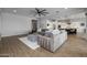 Open floor plan living room with a view into the kitchen at 10547 E Thornton Ave, Mesa, AZ 85212