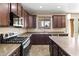 Modern kitchen with stainless steel appliances at 12029 W Overlin Ln, Avondale, AZ 85323