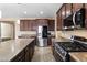 Kitchen with stainless steel appliances and island at 12029 W Overlin Ln, Avondale, AZ 85323