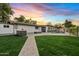 Expansive backyard with pool, fire pit and patio at 1302 W Golden Ln, Phoenix, AZ 85021