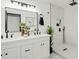 Modern bathroom with double vanity and large walk-in shower at 1302 W Golden Ln, Phoenix, AZ 85021
