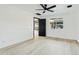 Bright bedroom with door leading to backyard at 1302 W Golden Ln, Phoenix, AZ 85021