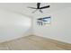 Bright bedroom with ceiling fan and large window at 1302 W Golden Ln, Phoenix, AZ 85021