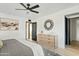 Spacious bedroom with dresser and access to another room at 1302 W Golden Ln, Phoenix, AZ 85021