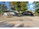 Mid-century modern home with mature trees and landscaping at 1302 W Golden Ln, Phoenix, AZ 85021