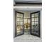French doors open to a living area with foosball table at 1302 W Golden Ln, Phoenix, AZ 85021
