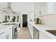 Modern kitchen with white cabinets, large island, and stainless steel appliances at 1302 W Golden Ln, Phoenix, AZ 85021