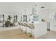 Spacious kitchen with island, white cabinets, and stainless steel appliances at 1302 W Golden Ln, Phoenix, AZ 85021