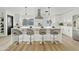 Modern kitchen with white cabinets, island, and stainless steel appliances at 1302 W Golden Ln, Phoenix, AZ 85021