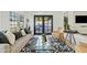 Bright living room features stylish furniture and access to a backyard patio at 1302 W Golden Ln, Phoenix, AZ 85021