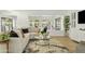 Bright living room with sectional sofa, coffee table, and large windows at 1302 W Golden Ln, Phoenix, AZ 85021