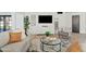 Cozy living room with neutral decor, large TV, and comfortable seating at 1302 W Golden Ln, Phoenix, AZ 85021