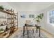 Home office with built-in shelving and large windows at 1302 W Golden Ln, Phoenix, AZ 85021