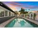 Stunning pool at sunset, surrounded by landscaping at 1302 W Golden Ln, Phoenix, AZ 85021