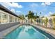 Inviting kidney-shaped pool with surrounding patio at 1302 W Golden Ln, Phoenix, AZ 85021