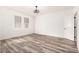 Spacious bedroom with modern ceiling fan, wood-look flooring, and natural light at 15221 N Clubgate Dr # 1110, Scottsdale, AZ 85254
