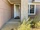 Front entry with screen door and small patio at 15221 N Clubgate Dr # 1110, Scottsdale, AZ 85254