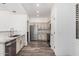 Galley kitchen features stainless appliances, neutral cabinetry, and modern finishes at 15221 N Clubgate Dr # 1110, Scottsdale, AZ 85254