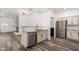 Modern kitchen features stainless steel appliances, granite countertops, and opens to the living room at 15221 N Clubgate Dr # 1110, Scottsdale, AZ 85254