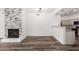 Open concept living area featuring stone fireplace and views into the kitchen at 15221 N Clubgate Dr # 1110, Scottsdale, AZ 85254