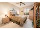 Comfortable bedroom with wood furniture and carpet at 19425 N Guardian Ln, Surprise, AZ 85387