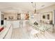 Open dining area with kitchen views and breakfast bar at 19425 N Guardian Ln, Surprise, AZ 85387