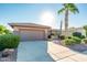 Single-story home with desert landscaping and a two-car garage at 19425 N Guardian Ln, Surprise, AZ 85387