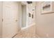 Bright hallway with tile floors and neutral walls at 19425 N Guardian Ln, Surprise, AZ 85387