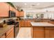 Well-equipped kitchen with island and ample counter space at 19425 N Guardian Ln, Surprise, AZ 85387