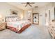 Main bedroom with king-size bed and ceiling fan at 19425 N Guardian Ln, Surprise, AZ 85387