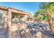 Covered patio with seating area and fountain at 19425 N Guardian Ln, Surprise, AZ 85387