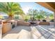 Relaxing patio with built-in grill and fountain at 19425 N Guardian Ln, Surprise, AZ 85387