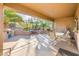 Covered patio with seating area and water feature at 19425 N Guardian Ln, Surprise, AZ 85387