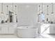 Stunning bathroom featuring dual vanities, a standalone tub, and beautiful tile work for a luxurious feel at 19702 E Melissa Pl, Queen Creek, AZ 85142