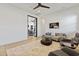 Comfortable living room features stylish seating, decor, and a seamless transition into the adjacent office space at 19702 E Melissa Pl, Queen Creek, AZ 85142