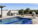 Relaxing outdoor space with a stunning pool, spa, built in barbeque and hanging chairs for a serene ambiance at 19702 E Melissa Pl, Queen Creek, AZ 85142