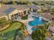 Aerial view of a luxurious property with a large pool and putting green at 27432 N 66Th Way, Scottsdale, AZ 85266