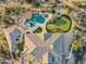 Bird's-eye view of a large estate, pool, putting green, and landscaping at 27432 N 66Th Way, Scottsdale, AZ 85266
