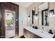 Double vanity bathroom with access to backyard at 27432 N 66Th Way, Scottsdale, AZ 85266