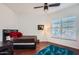 Cozy bedroom with a full-size bed, a desk, and plenty of natural light at 27432 N 66Th Way, Scottsdale, AZ 85266