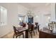Elegant dining room with a large chandelier and hardwood floors at 27432 N 66Th Way, Scottsdale, AZ 85266