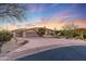 Stunning desert home with a large driveway and landscaped front yard at 27432 N 66Th Way, Scottsdale, AZ 85266