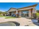 Back exterior showcasing a large covered patio, putting green, and pool at 27432 N 66Th Way, Scottsdale, AZ 85266