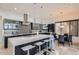 Modern kitchen with large island, stainless steel appliances, and breakfast nook at 27432 N 66Th Way, Scottsdale, AZ 85266