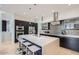 Modern kitchen with large island, stainless steel appliances, and breakfast nook at 27432 N 66Th Way, Scottsdale, AZ 85266