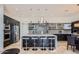 Modern kitchen with large island, stainless steel appliances, and breakfast nook at 27432 N 66Th Way, Scottsdale, AZ 85266