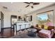 Modern kitchenette with breakfast bar and living area at 27432 N 66Th Way, Scottsdale, AZ 85266