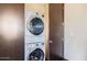 Stackable washer and dryer in this laundry closet at 27432 N 66Th Way, Scottsdale, AZ 85266