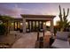 Outdoor patio with seating area and desert plants at 27432 N 66Th Way, Scottsdale, AZ 85266