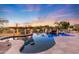 Large, freeform pool and spa with a rock waterfall and pergola at 27432 N 66Th Way, Scottsdale, AZ 85266